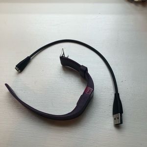 purple fitbit with charger